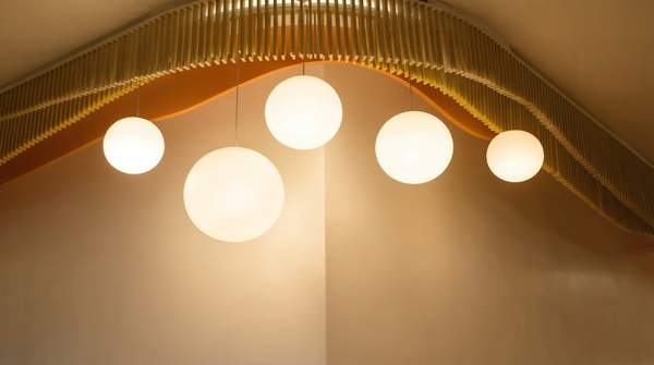 Editorial illustration for Choosing Statement Lighting for Your Living Room: A Fixture-by-Fixture Decision Guide