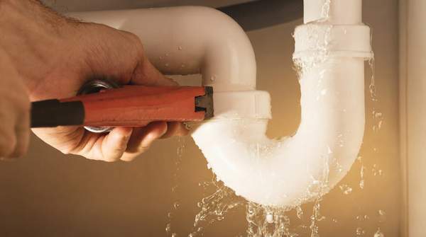 Editorial illustration for One Slow Drain or Five? How to Tell If Your Plumbing Problem Is a Quick Fix or a Professional Job